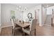 Elegant dining room featuring a chandelier, hardwood floors, and comfortable seating for Gathering gatherings at 1963 Longhorn Ln, Summerville, SC 29485
