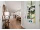 Warm and inviting entryway leading to an open-concept kitchen and dining area with modern finishes at 1963 Longhorn Ln, Summerville, SC 29485