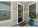 Inviting front door with decorative wreath and stylish exterior lighting for welcoming guests at 1963 Longhorn Ln, Summerville, SC 29485