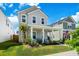 Charming two-story home with a welcoming front porch and well-manicured lawn, perfect for relaxing at 1963 Longhorn Ln, Summerville, SC 29485
