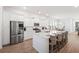 Spacious kitchen with a large center island, stainless steel appliances, and wood floors at 1963 Longhorn Ln, Summerville, SC 29485