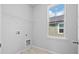 Clean and bright laundry room featuring window and washer/dryer hookups at 1963 Longhorn Ln, Summerville, SC 29485