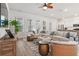 Living room has a sectional sofa, two round tables, and lots of sunlight at 1963 Longhorn Ln, Summerville, SC 29485