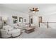 Upstairs living room featuring neutral colors, a decorative ceiling fan, and plush carpeting at 1963 Longhorn Ln, Summerville, SC 29485