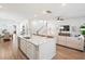 Open-concept living area features a kitchen island, staircase, and comfortable seating at 1963 Longhorn Ln, Summerville, SC 29485