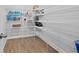Walk-in pantry has wire shelving and wood-look flooring, perfect for storage at 1963 Longhorn Ln, Summerville, SC 29485