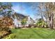 Well-maintained backyard featuring a lush lawn, flowerbeds, and a partial privacy fence at 2050 S Smokerise Way, Mount Pleasant, SC 29466