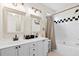 Modern bathroom with double sinks, a soaking tub, and elegant finishes at 2050 S Smokerise Way, Mount Pleasant, SC 29466