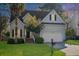 Charming two-story home featuring a manicured front lawn and attached two-car garage at 2050 S Smokerise Way, Mount Pleasant, SC 29466