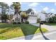 Well-maintained two-story home with a lush green lawn and an inviting, neatly paved driveway at 2050 S Smokerise Way, Mount Pleasant, SC 29466