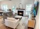 Inviting living room with a cozy fireplace, comfortable seating, and lots of natural light at 2050 S Smokerise Way, Mount Pleasant, SC 29466