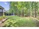 Expansive backyard with mature trees providing shade and privacy for outdoor enjoyment at 2136 Kings Gate Ln, Mount Pleasant, SC 29466