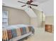 Bedroom with carpet and a ceiling fan, featuring unique angled walls and dormer windows at 2136 Kings Gate Ln, Mount Pleasant, SC 29466