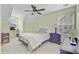 Comfortable bedroom with neutral tones, ceiling fan, and a small desk next to the window at 2136 Kings Gate Ln, Mount Pleasant, SC 29466