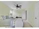 Bedroom with neutral walls, ceiling fan, and carpeted floors, lit by lamps on side tables at 2136 Kings Gate Ln, Mount Pleasant, SC 29466