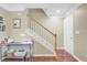 Cozy entryway with hardwood floors, staircase, and a convenient workspace featuring a desk and printer at 2136 Kings Gate Ln, Mount Pleasant, SC 29466