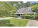 Charming single Gathering home with a well maintained front yard, mature trees, and a long driveway at 2136 Kings Gate Ln, Mount Pleasant, SC 29466