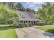 Charming single Gathering home with a well maintained front yard, mature trees, and a long driveway at 2136 Kings Gate Ln, Mount Pleasant, SC 29466