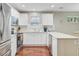 Modern kitchen with white cabinets, stainless steel appliances and hardwood floors at 2136 Kings Gate Ln, Mount Pleasant, SC 29466