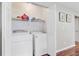 Laundry room in closet with washer, dryer and shelving for storage at 2136 Kings Gate Ln, Mount Pleasant, SC 29466