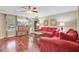 Bright and airy living room with hardwood floors, ceiling fan, and ample natural light at 2136 Kings Gate Ln, Mount Pleasant, SC 29466