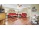 Open concept living room has beautiful hardwood floors, ceiling fan and neutral wall color at 2136 Kings Gate Ln, Mount Pleasant, SC 29466