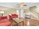 Bright and airy living room with hardwood floors, ceiling fan, stairway access and neutral wall color at 2136 Kings Gate Ln, Mount Pleasant, SC 29466