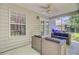 Covered patio with stylish seating area and fan for comfortable outdoor living at 2136 Kings Gate Ln, Mount Pleasant, SC 29466
