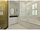 Bright bathroom with soaking tub, framed mirrors, and shower stall at 2258 Arthur Gaillard Ln, Charleston, SC 29414