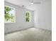 Bright, carpeted bedroom with neutral paint, ceiling fan and multiple windows at 2258 Arthur Gaillard Ln, Charleston, SC 29414