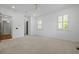 Spacious bedroom with three windows, plantation shutters, neutral carpet, and white walls at 2258 Arthur Gaillard Ln, Charleston, SC 29414