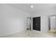 Bedroom with neutral carpeting and paint, and black doors at 2258 Arthur Gaillard Ln, Charleston, SC 29414