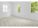 Bedroom with natural light, neutral paint, plush carpet and two windows at 2258 Arthur Gaillard Ln, Charleston, SC 29414
