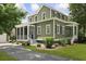 Charming two-story home with manicured landscaping, walkway, and screened porch at 2258 Arthur Gaillard Ln, Charleston, SC 29414