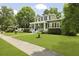 Charming two-story home with lush landscaping, walkway, and cozy front porch at 2258 Arthur Gaillard Ln, Charleston, SC 29414