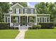 Charming two-story home with a welcoming front porch and well-manicured lawn, enhancing its curb appeal at 2258 Arthur Gaillard Ln, Charleston, SC 29414