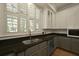 Well-lit kitchen features granite countertops, stainless steel appliances, and custom cabinets at 2258 Arthur Gaillard Ln, Charleston, SC 29414