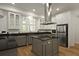 Stylish kitchen boasts granite countertops, stainless steel appliances, and custom cabinetry at 2258 Arthur Gaillard Ln, Charleston, SC 29414
