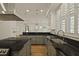 Open kitchen with granite counters, stainless appliances and view into the dining space at 2258 Arthur Gaillard Ln, Charleston, SC 29414