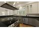 Modern kitchen featuring gray cabinets, stainless appliances, and granite countertops at 2258 Arthur Gaillard Ln, Charleston, SC 29414