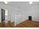 Upstairs landing with hardwood floors, black doors and white trim at 2258 Arthur Gaillard Ln, Charleston, SC 29414