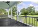 Spacious porch featuring a dark-stained wood floor and a painted ceiling, offering a relaxing outdoor space at 2258 Arthur Gaillard Ln, Charleston, SC 29414