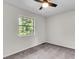 An empty bedroom with a large window that offers great light; walls are neutral; no furniture in room at 2362 Parsonage Rd # 2H, Charleston, SC 29414
