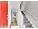 Bright entryway showcasing stairs, wood floors, and a door leading to the outside, creating a welcoming transition at 2362 Parsonage Rd # 2H, Charleston, SC 29414