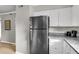 Stainless steel refrigerator and updated countertops in a light and bright kitchen at 2362 Parsonage Rd # 2H, Charleston, SC 29414