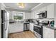 Updated kitchen with stainless steel appliances, granite countertops, and a view of the exterior at 2362 Parsonage Rd # 2H, Charleston, SC 29414