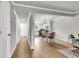 Open-concept living room and dining area with wood floors and neutral walls, creating a seamless and inviting space at 2362 Parsonage Rd # 2H, Charleston, SC 29414
