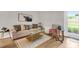 Relaxing living area combines stylish decor, cozy textures, and light wood floors, perfect for modern comfort at 2362 Parsonage Rd # 2H, Charleston, SC 29414