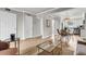 Bright living area featuring stylish furnishings, light wood floors and an open layout to the dining space at 2362 Parsonage Rd # 2H, Charleston, SC 29414