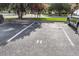 Designated parking spot with clear markings, surrounded by trees, ensuring convenient and organized parking at 2362 Parsonage Rd # 2H, Charleston, SC 29414